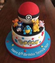 a birthday cake with pokemon characters on it