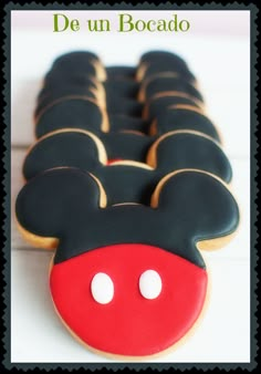 mickey mouse cookies are arranged in the shape of ears