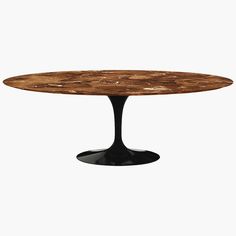 an oval wooden table with black legs and a marble top, against a white background