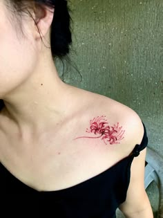 a woman with a tattoo on her shoulder