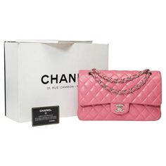 The iconic "Must Have" Chanel Timeless Medium 25cm double flap shoulder bag in pink quilted lambskin leather, silver metal trim, a handle-silver metal chain interlaced with pink leather for hand or shoulder or crossbody carry Metal flap closure with silver CC logo Patch pocket on the back of the bag Inner lining in pink leather, a double patch pocket, 1 passing with lipstick Signature : "Chanel Made in France" Date: 2014 Dimensions: 25x15x6 cm (10x6x2,4 Inches) Chain length: 43 cm (17 Inches) Re Chanel Double Flap, Flap Shoulder Bag, Metal Trim, Leather Silver, Cc Logo, Pink Leather, Lambskin Leather, Pink Bag, Metal Chain