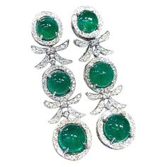 An exclusive pair of earrings in sophisticated design, so fashionable, a very adorable style, by Italian jewelry designer. Earrings come in 18K gold with 6 pieces of Natural Zambian Emeralds, spectacular color., fine quality, in perfect mixed, oval cabochon cut , of 18.80 carats, and 132 pieces of Natural Diamonds, in round brilliant cut , of 1,90 carats, F/G color VS clarity, very sparkly. Piece of high jewelry. Handcrafted by artisan goldsmith. Excellent manufacture and quality of stones. Comp Italian Jewelry Designers, Emerald Diamond Earrings, Adorable Style, 18k Gold Earrings, Zambian Emerald, Italian Jewelry, Dream Jewelry, Zambia, Oval Cabochon