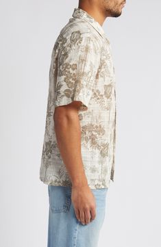 Ready for your packing list, this cotton shirt features a muted print of swaying palms and fresh flowers. 27 1/4" length; 42" chest length (size Medium) Front button closure Notched collar Short sleeves 100% cotton Machine wash, line dry Imported Hawaiian Button-up Top With Palm Tree Print, Hawaiian Button-up Tops With Palm Tree Print, Cotton Hawaiian Shirt With Floral Print, Relaxed Fit Short Sleeve Shirt With Palm Tree Print, Hawaiian Cotton Floral Print Shirt, Beige Printed Shirt With Relaxed Fit, Beige Printed Cotton Shirt, Beige Cotton Printed Shirt, Casual Button-up Shirt With Hibiscus Print