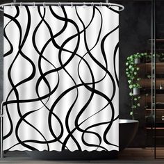 a shower curtain with black and white wavy lines on it in front of a bathtub