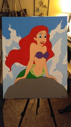 the little mermaid is sitting on top of a piece of paper with her hair blowing in the wind