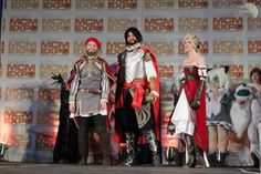 the actors are dressed in medieval costumes on stage at an event for comic conclavers