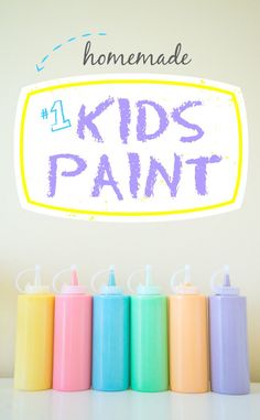 the words homemade kids paint are in front of colorful spray bottles on a white surface