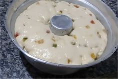 a food processor filled with cheese on top of a counter