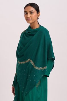 Emerald shawl with frayed edges and zari embroidered motifs.
Component: 1
Pattern: Embroidered
Type Of Work: Zari Work
Fabric: Woollen
Color: Green
Other Details: 
Frayed edges
Zari embroidered
Note: Kurta and pant worn by the model is not for sale
Occasion: NA - Aza Fashions Traditional Festive Scarves With Embroidered Border, Shawl With Embroidered Border For Eid, Festive Embroidered Traditional Drape Scarves, Embroidered Shawl For Eid, Festive Embroidered Scarves With Traditional Drape, Eid Shawl Scarves With Embroidered Border, Festive Scarves With Intricate Embroidery In Traditional Drape, Festive Scarves With Intricate Embroidery And Traditional Drape, Festive Scarves With Embroidered Border