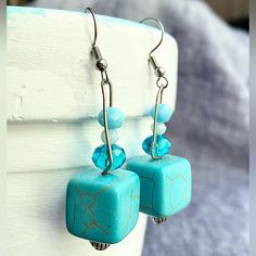 Handcrafted In My Studio. Square Turquoise Bead Complemented By Silver And Glass Beads. Stainless Fish Hook. 2” Dangle Turquoise Jewelry With Faceted Beads For Summer, Summer Turquoise Jewelry With Faceted Beads, Turquoise Faceted Beads Jewelry For Summer, Summer Turquoise Dangle Beaded Earrings, Turquoise Beaded Dangle Earrings For Gift, Hypoallergenic Turquoise Beaded Dangle Earrings, Turquoise Faceted Bead Earrings, Turquoise Earrings With Faceted Beads, Adjustable Turquoise Earrings With Faceted Beads