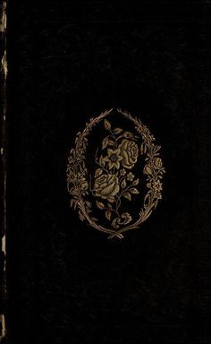 a black book with gold floral designs on it