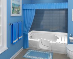 a bathroom with blue walls and curtains on the window sill, toilet and bathtub