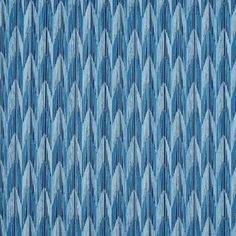 a blue and white background with an abstract pattern on it's fabric, which is very similar to the design in this image