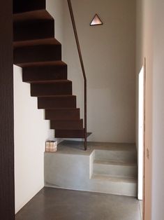 the stairs are made of wood and have metal handrails