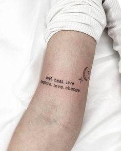 a person with a tattoo on their arm that says, feel heal live explore love change