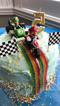 a birthday cake with mario kart on top