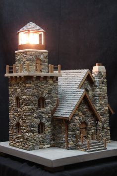 a model of a stone building with a light on top