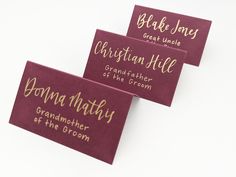 three business cards with gold lettering on them, one for grandma and the other for grandson