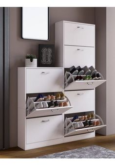 an organized shoe rack in the corner of a room next to a dresser and mirror