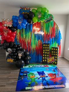 a room filled with balloons and posters on the wall