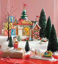 a christmas village with santa claus and his sleigh