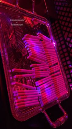 the case is filled with many pink toothbrushes