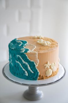 a cake with blue icing and white frosting