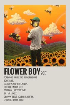 a man standing in front of a field of sunflowers with the words flower boy on it