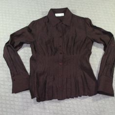 New Never Worn Cold Water Creek Button Up Top With A Ruched Front That Gives A Ruffled Bottom Illusion. Slightly Sheer With Almost A Metallic Sheen. The Cut Of This Top Is Fitted. It Is A Dark Chocolate Brown, Very Beautiful Color. New Without Tags Size: Petite Xsmall. Happy To Answer Questions, Bundle With Other Items To Save On Shipping And Take Reasonable Offers. New To Poshmark? Enter Code Style_exchange During Sign-Up To Get $10 Off Your First Order! The Actual Color Of The Item May Vary Sl Fitted V-neck Shirt With Button Cuffs, Office Brown Top With Button Cuffs, Brown Office Tops With Button Cuffs, Office Brown Tops With Button Cuffs, Office-appropriate Brown Tops With Button Cuffs, Fitted V-neck Shirt With Button Closure, Brown Buttoned Top For Office, Brown Formal Top With Button Cuffs, Formal Brown Top With Button Cuffs