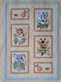 a quilted wall hanging with animals on it