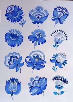 an image of blue flowers on white paper