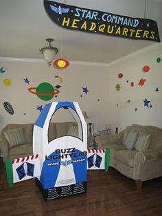 a toy story birthday party with an inflatable space ship and rocket ship bed