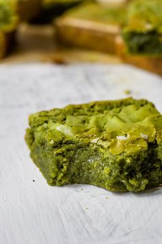 a piece of green food sitting on top of a table