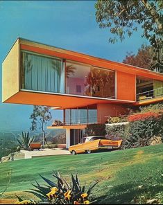 an orange house on the side of a hill