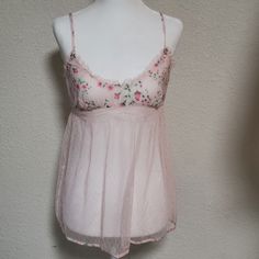 Very Pretty Light Pink Babydoll W/ Floral Design Circa 2004 - Pastel Light Pink With Floral Design - Empire Waist - Soft Cotton Bust Area W/ Mesh Ruffle Detailing (Bust Area Does Not Have Defined Cups) - Loose Flowy Mesh Body W/ Floral Trim - Adjustable Spaghetti Straps - Size Small - Nwt; Excellent Condition; Never Been Worn; No Flaws - Smoke-Free Home - Offers Welcome; Bundle For Extra Savings *Bust Form Size 2-4 Pink Spring Bedtime Tops, Pink Sheer Cami Top, Feminine Fitted Bedtime Tops, Victoria's Secret Feminine Spring Camisole, Pink Summer Bedtime Camisole, Victoria's Secret Sheer Tops For Spring, Victoria's Secret V-neck Spring Camisole, Pink Sheer Camisole Top, Pink Spring Camisole For Bedtime