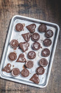 chocolate hearts on a baking sheet ready to be baked in the oven for valentine's day