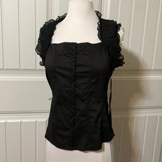 New Small Black Loe Stitch Button-Down Sleeveless Ruffled Top With Ruched Back Bust Approximately 32” Waist Approximately 30” Back Length Approximately 21” P34 Fitted Sleeveless Blouse With Button Closure, Black Ruffled Top For Alternative Fashion, Black Ruffled Spaghetti Strap Tops, Black Sleeveless Smocked Top With Ruffles, Black Sleeveless Blouse With Button Closure, Black Button-up Top With Ruffles, Black Button-up Blouse With Back Button Closure, Black Ruffled Button-up Blouse, Black Floral Top