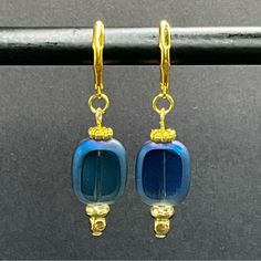 Handmade Gold And Royal Blue Glass Beaded Earrings From Desert Beads Gorgeous Royal Blue Transparent Frosted Blue Glass Beads Make These Earrings Stand Out! Gold Plated Beads, Finding And Ear Wires. Overall Length 1.75”. See Photos For More Measurements. New Handmade In My Arizona Jewelry Design Studio. Please Let Me Know If You Have Any Questions. Ready To Ship. Note Colors May Be Slightly Different From The Pictures Because Of Different Device Display Settings. Bundle Items To Save On Shipping Elegant Adjustable Beaded Glass Earrings, Elegant Glass Beaded Drop Earrings, Gold Beaded Glass Earrings, Elegant Blue Czech Glass Earrings, Blue Glass Round Bead Earrings, Blue Round Bead Glass Earrings, Blue Glass Round Beads Earrings, Blue Czech Glass Drop Earrings, Blue Earrings With Colorful Czech Glass Beads