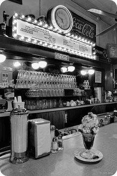 a bar with a clock on the wall above it