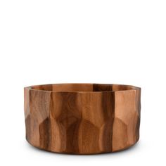 the wooden bowl is made out of wood and has an unusual pattern on it's surface