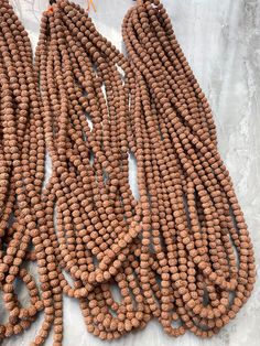 Welcome, Namaste  Natural 6 mm Rudraksha beads Size Of Beads : 6 mm Number Of Beads : Variation of ( 101, 501, 1101) beads as per your requirement Wholesale Price 100% Original & Authentic ORIGIN :: Java indonesia Festival Mala With Polished Round Beads, Festival Mala With Polished Beads, Polished Round Beaded Necklace For Puja, Polished Beaded Necklaces For Puja, Handmade Round Beaded Necklaces For Puja, Hand-strung Beads For Jewelry Making And Festivals, Round Polished Beaded Necklaces For Puja, Handmade Beaded Necklaces With Round Beads For Puja, Bohemian Beaded Necklaces With Polished Beads For Puja