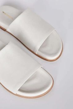 Minimal and effortless we love pippy for all the ease of an ultra-padded slip-on. luxe vegan leathers and comfy footbeds make this iconic slide new again. Trendy Leather Slides With Round Toe, Everyday Slip-on Slides With Textured Footbed, Everyday Leather Slip-on Slides, Modern Everyday Slip-on Slides, White Slides With Cork-bed Midsoles For Spring, Comfortable Synthetic Slides For Everyday, Comfortable Everyday Synthetic Slides, Trendy Leather Slides With Cushioned Footbed, Trendy Slides With Leather Footbed And Round Toe