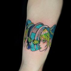 a woman's arm with a colorful tattoo on it