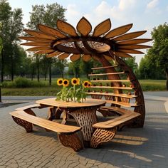 a wooden table and bench with sunflowers in the center on a brick patio