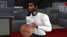 a man holding a basketball in his right hand and wearing headphones on the other