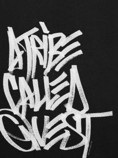 some type of graffiti written in white on a black background