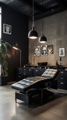 an office with black furniture and pictures on the wall, including a large desk chair