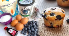 blueberry muffins, yogurt and other ingredients on a table