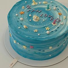 there is a blue cake with stars on it