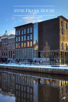 an image of a building that is on the water in front of some other buildings